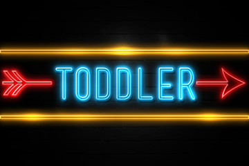 Obraz premium Toddler - fluorescent Neon Sign on brickwall Front view