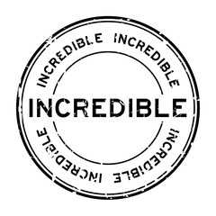 Grunge black incredible round rubber seal stamp on white background