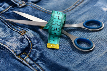 Jeans crotch and pocket with scissors and measure tape