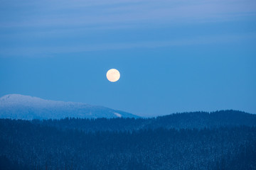 Full moon rising over winter Smoky Mountains