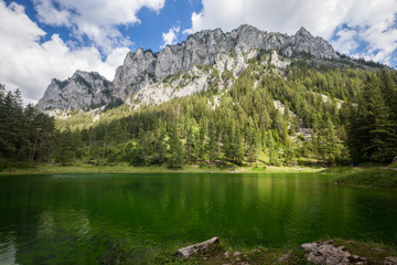 Naklejka na ściany i meble Alpine mountaine green lake