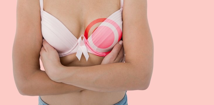 Composite image of woman in bra with breast cancer awareness