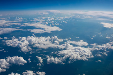 Fototapeta na wymiar views of clouds and land from airplane window