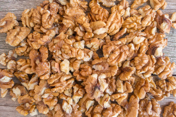 Walnuts on a wooden background, texture