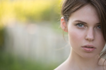 Model with naked shoulders on sunny day