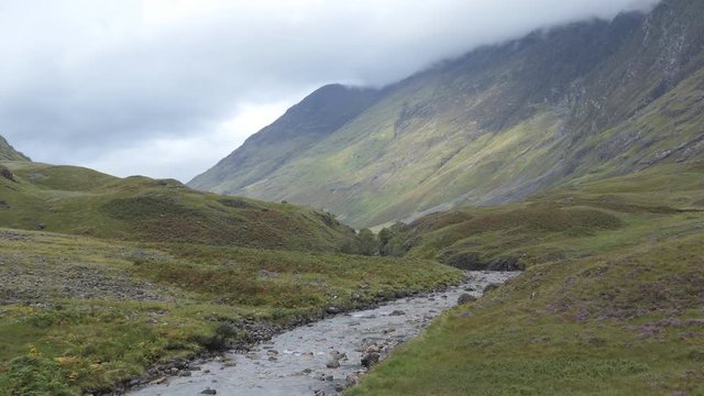A view of the clouds and a mountain stream. Scotland.