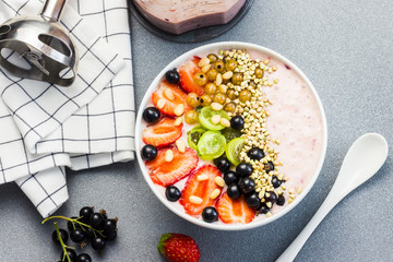 Healthy breakfast-smoothie bowl with berries and nuts.  Top view.