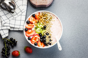 Healthy breakfast - smoothie bowl with berries and nuts. Gluten free breakfast - berries and nuts smoothie bowl.  Top view.
