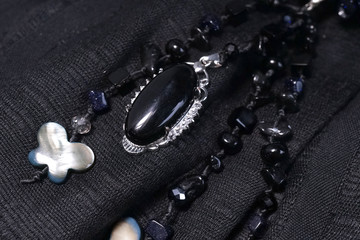 Black gemstone for necklace, lady accessories. Soft focus on the gemstone.