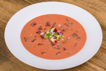 Cold borscht - speciality for hot summer days. Vegetable cold soup with beet, cucumber, potato, radsih and egg . Close up