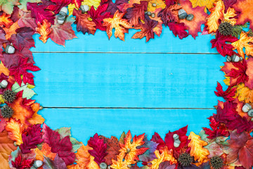 Blank teal blue sign with colorful fall leaves border