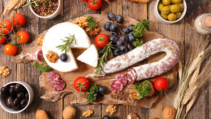 Fototapeta na wymiar composition of charcuterie,cheese,olive and fruits