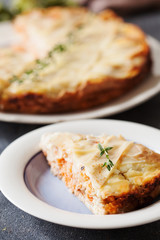 Fresh round fish pie on dark background