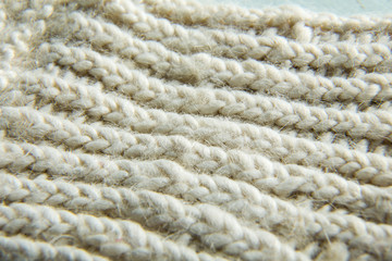 Extremely close-up. White knitted scarf.
