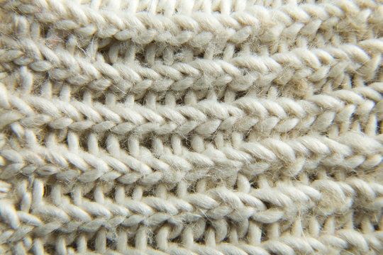 Extremely close-up. White knitted scarf.
