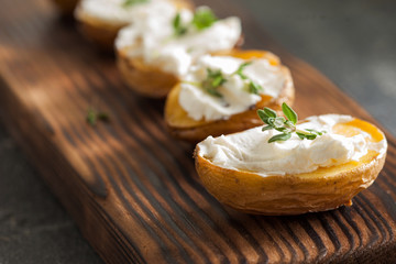 Baked spicy potatoes with thyme on parchment