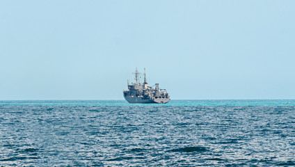 Boat or ship navigating on blue Black Sea water, cargoboat