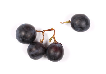 Dark grapes, isolated on white background, top view