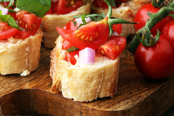Bruschetta with tomatoes, herbs and oil on toasted garlic cheese bread toasted with chopped tomatoe