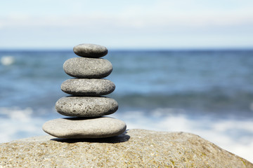 Fototapeta na wymiar concept of balance and harmony. rocks on the coast of the Sea