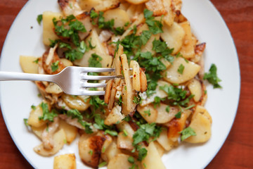 Fried potatoes with bacon and parsley V