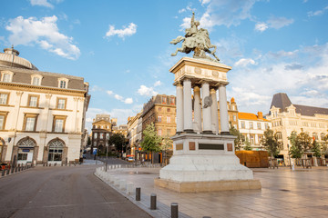 Obraz premium View on the Jaude square with statue during the sunset in Clermont-Ferrand city in central France