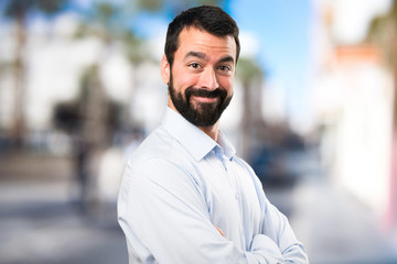 Handsome man with beard on unfocused background