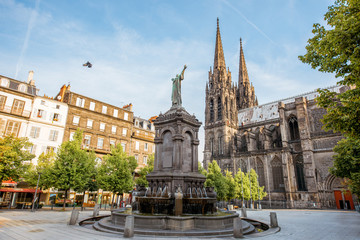 Fototapeta Morning view on the Victory square with monument and cathedral in Clermont-Ferrand city in France obraz