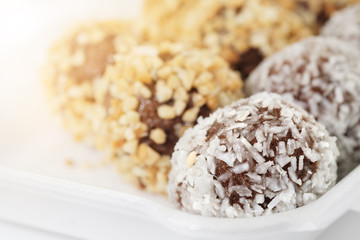 Chocolate donuts ball / View of chocolate donuts ball on white foam container.