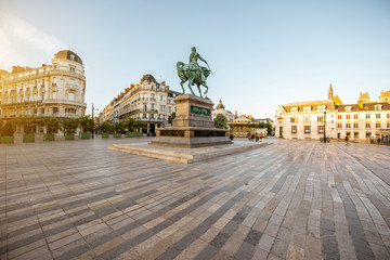 View on the Martroi square with statue of Saint Joan of Arc in Orleans city during the sunset in France
