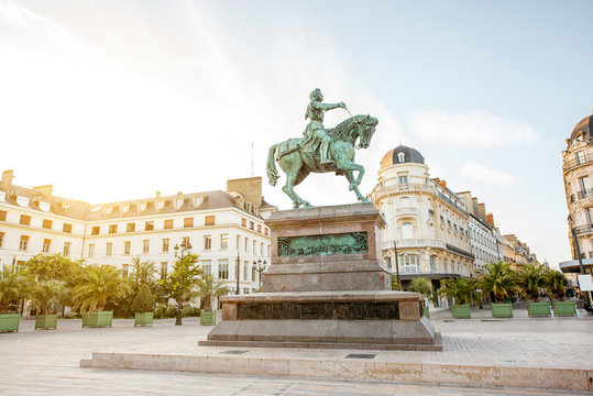 View on the Martroi square with statue of Saint Joan of Arc in Orleans city during the sunset in France