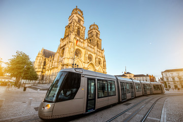 Street view on the saint Croix cathedral with tram in Orleans city during the sunset in central...