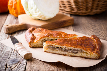 Slices of cabbage and mushroom pie with cheese