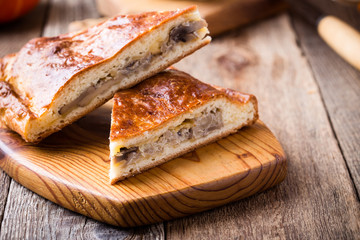 Slices of cabbage and mushroom pie with cheese