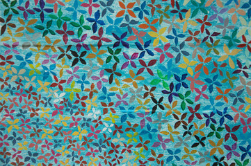 Multicolored flower patterned wood panel background