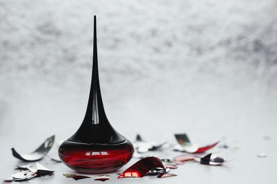 Red Perfume Bottle On Light Background