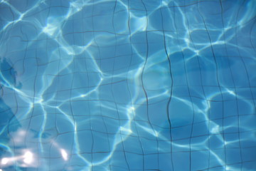 Fototapeta na wymiar Swimming pool water abstract background with seamless loop.