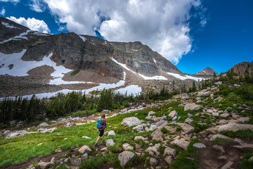 Fototapeta premium Backpacker entering the Valley near Blue lake Colorado