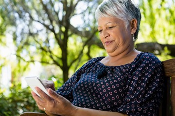Fototapeta premium Senior woman using mobile phone