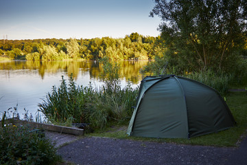 Fishing tent with a fishing rod.