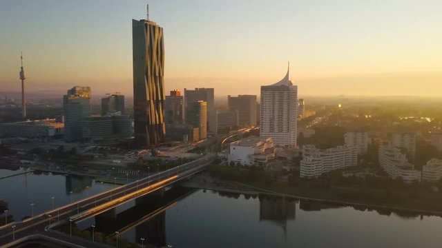 vienna city skyline aerial view at sunrise flying around skyscrapers
