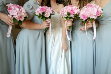 Bride with flowers and maids