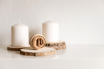 Wedding rings on the wooden stand in the room