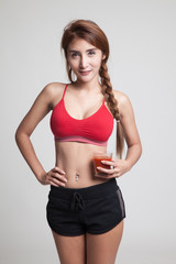 Fototapeta premium Beautiful healthy Asian girl with tomato juice.
