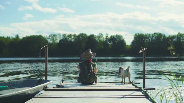 Boy On A Pier With Dog