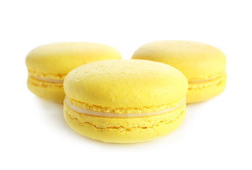 Lemon macarons on white background