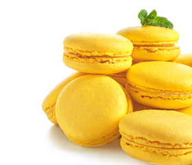 Lemon macarons on white background