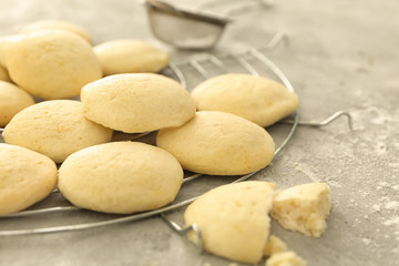 Cooling rack with homemade lemon cookies on table