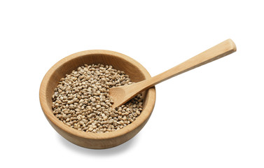 Bowl with hemp seeds and spoon on white background