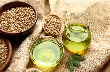Composition with hemp oil and seeds on sackcloth